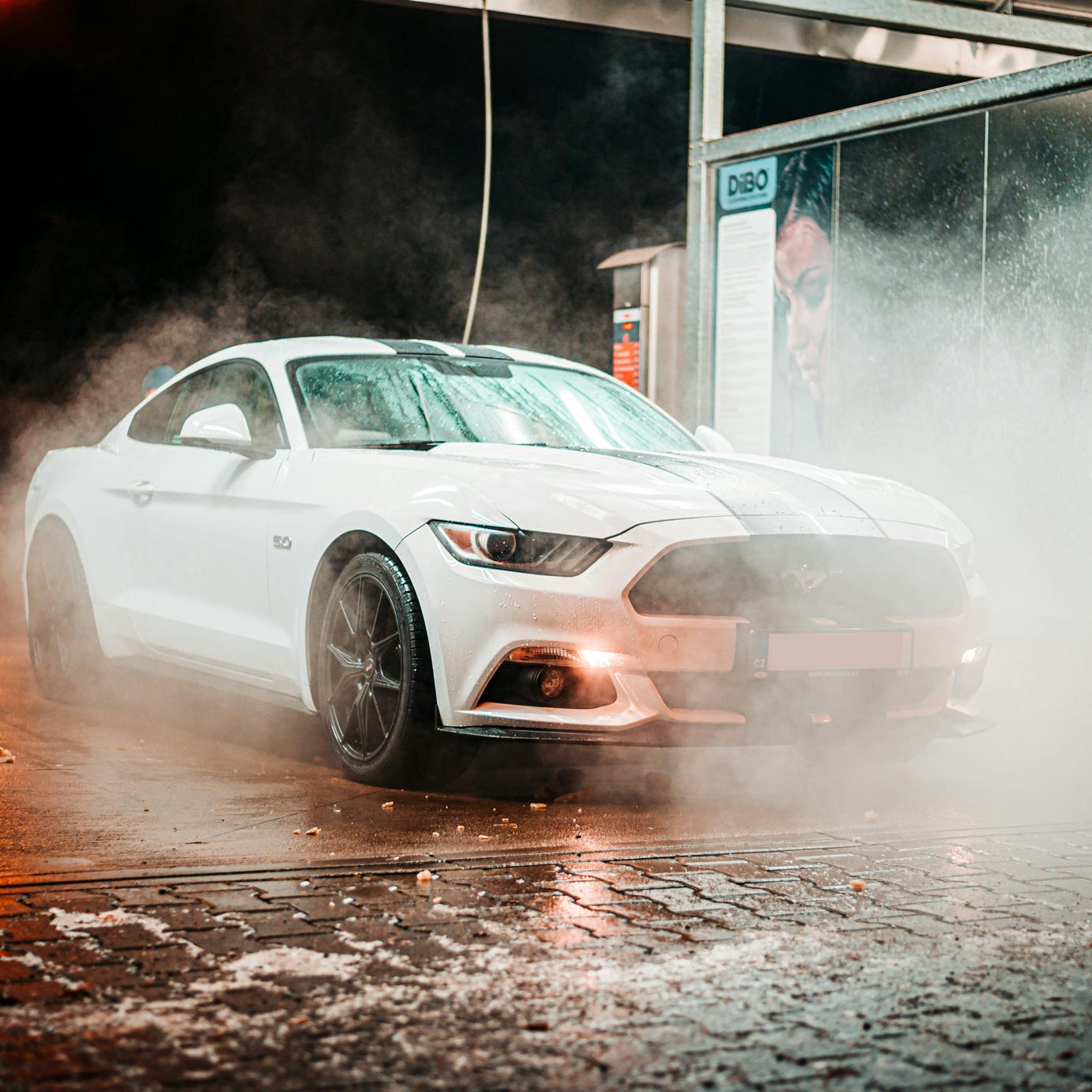 Car Being Wash by Man